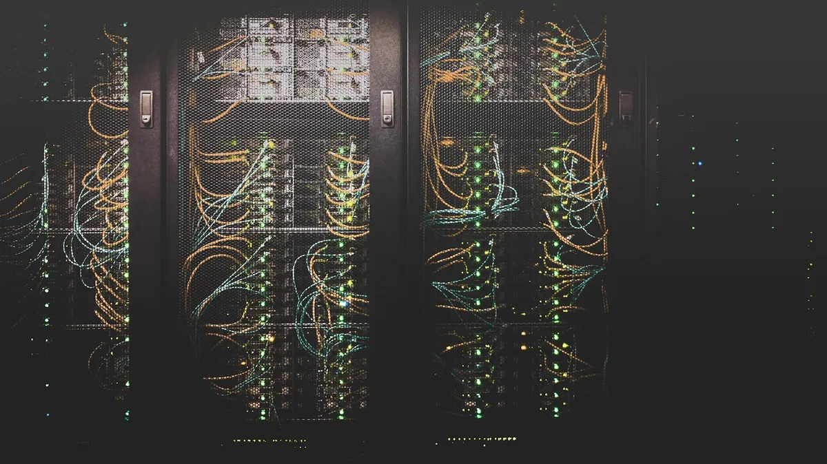 Rows of illuminated servers in a data centre
