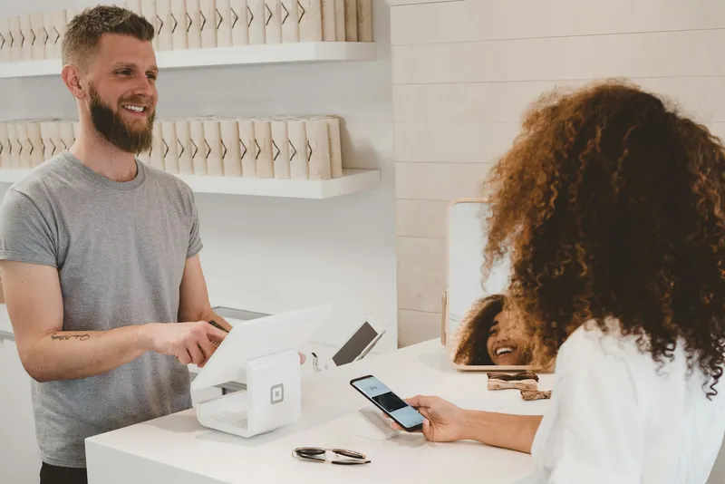 A payment card held near a card reader